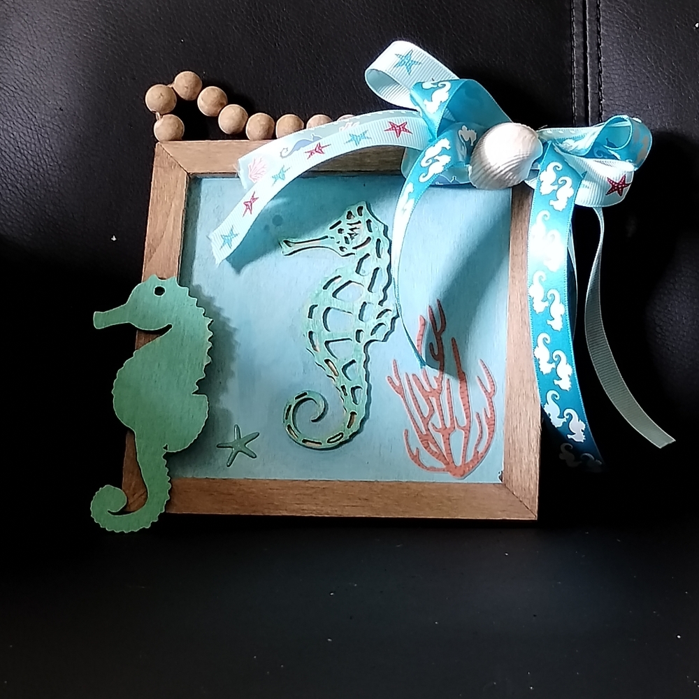 Wooden sea horses wall art with blue ocean life ribbons 